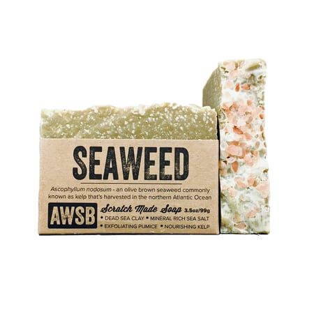 Two bars are shown: one wrapped, labeled A Wild Soap Bar - Seaweed by A Wild Soap Bar, with Dead Sea clay and kelp; the other unwrapped, displaying a textured pink and green surface suggesting Himalayan sea salt’s exfoliating qualities.