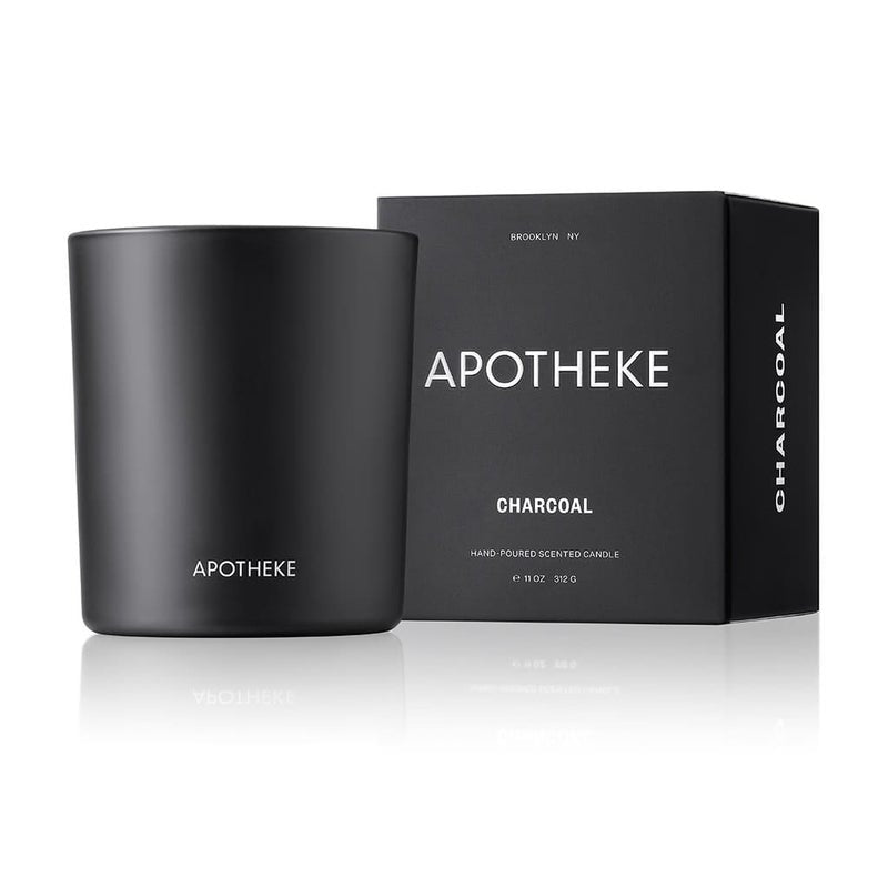 The luxurious Apotheke Charcoal 10.5oz candle, featuring a sleek black design with APOTHEKE in white, comes in a matching box labeled APOTHEKE CHARCOAL. Hand-poured in Brooklyn NY, this premium soy wax candle weighs 11 oz (312g).