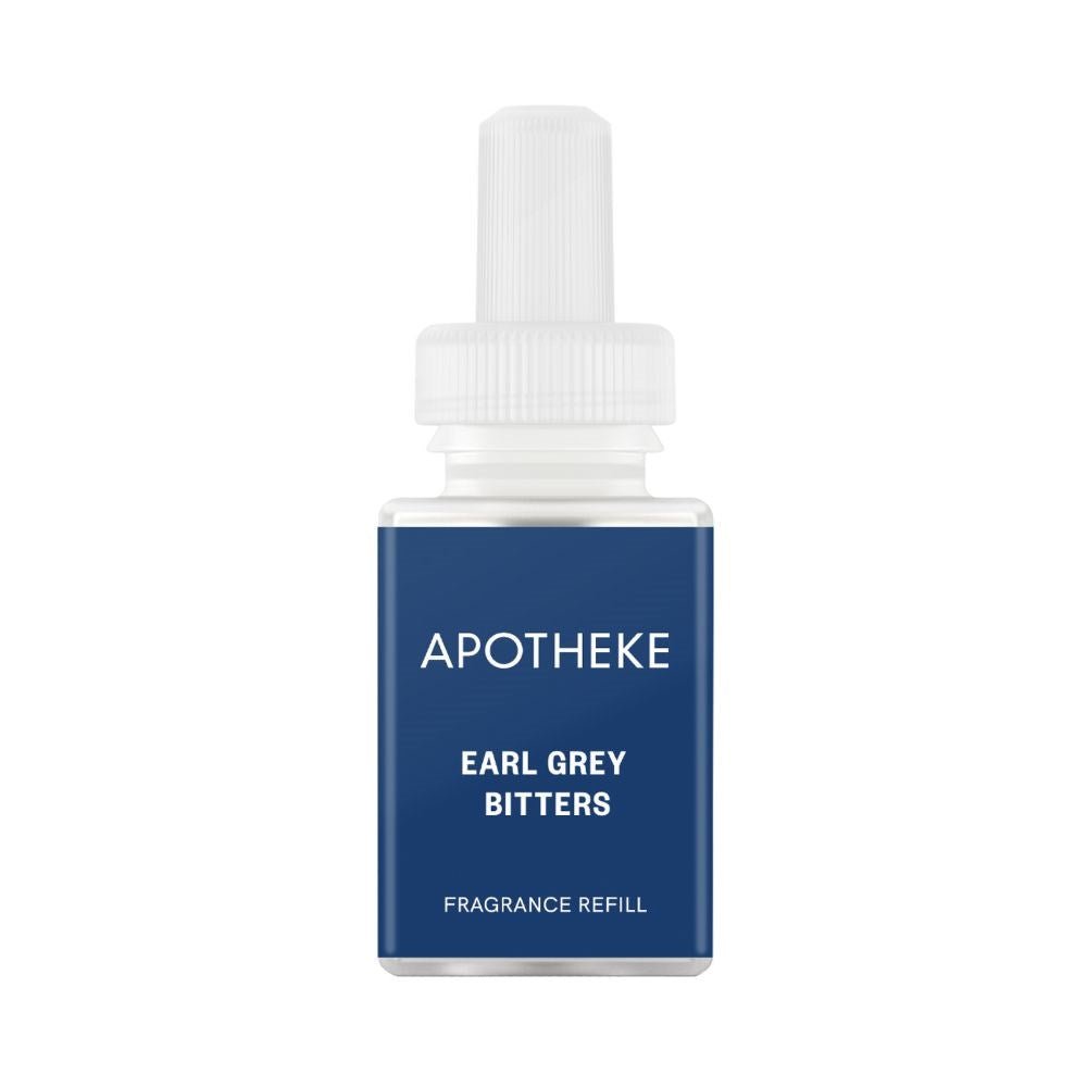 A small bottle with a white cap and blue label shows APOTHEKE in bold, displaying Earl Grey Bitters Refill beneath. Its crafted for the Pura Smart Diffuser, exuding elegance against a plain white backdrop.