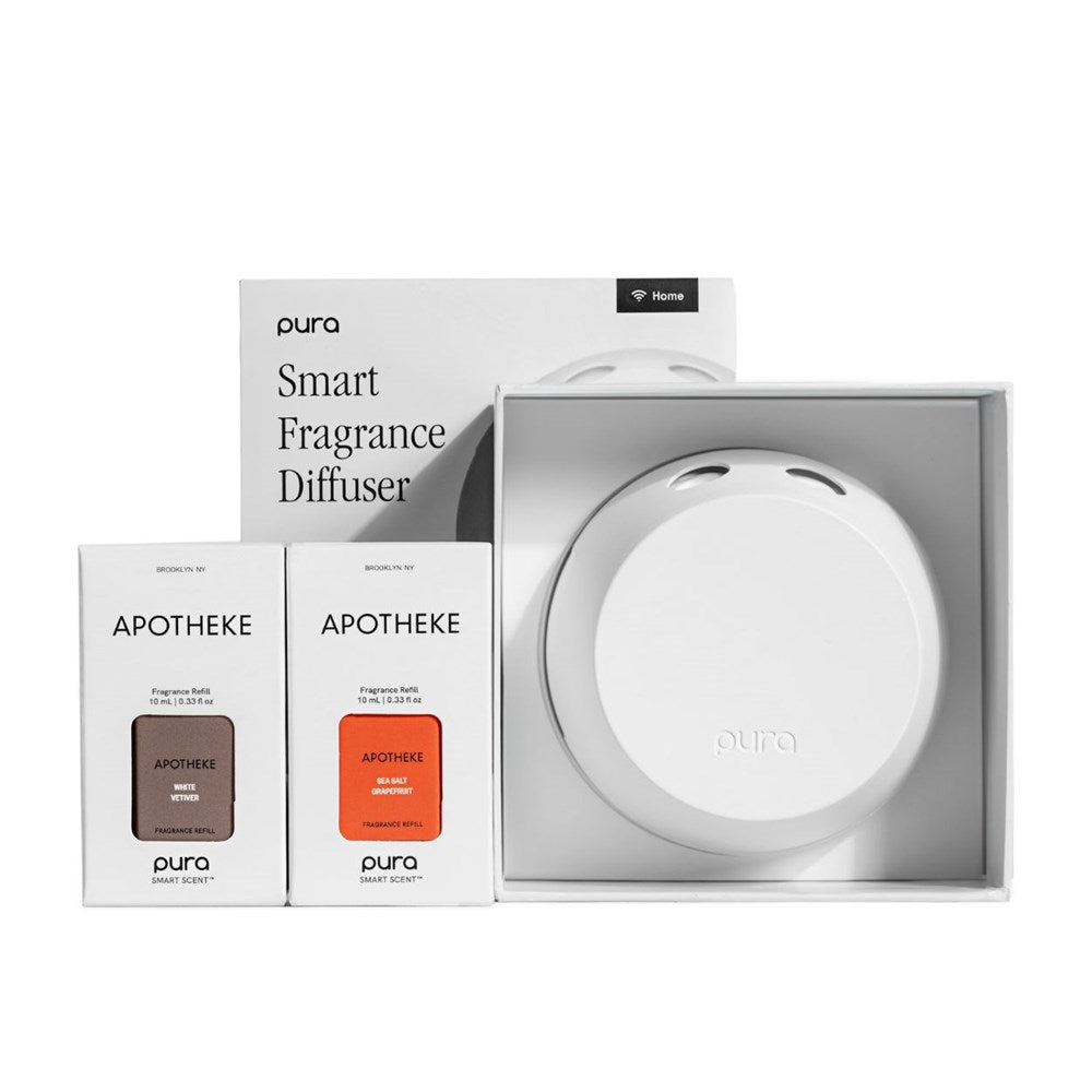 Image of the Apotheke - Pura Smart Fragrance Diffuser Set with its sleek packaging. It includes two customizable fragrance refill boxes, offering various scents. The minimalist design integrates seamlessly with smartphone control for a modern scent experience.