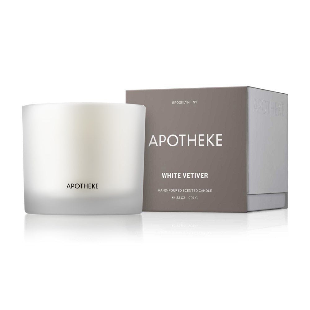 The Apotheke - White Vetiver 3-Wick Candle, hand-poured with premium soy wax, offers a luxury aromatic experience in a minimalist frosted glass container embossed with APOTHEKE. It comes in a matching gray box labeled Brooklyn NY.