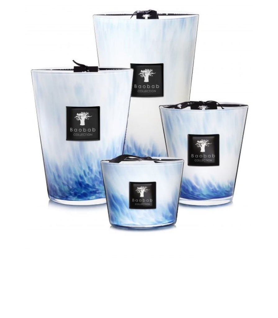 The EDEN SEASIDE collection by Baobab features four decorative candles in glass holders with a blue and white marbled design, each bearing a black Baobab label. Arranged from largest to smallest, these scented candles evoke a solar & aquatic ambiance.