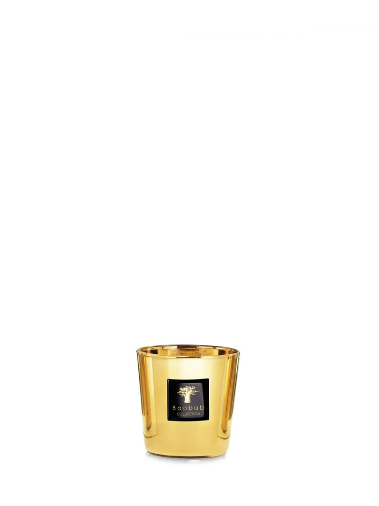 A Boabab - Les Exclusives Aurum Max 16 Candle, with a shiny gold holder and black Baobab logo label, sits elegantly against a plain white background. It releases a subtle jasmine musk fragrance that complements its sophisticated design.