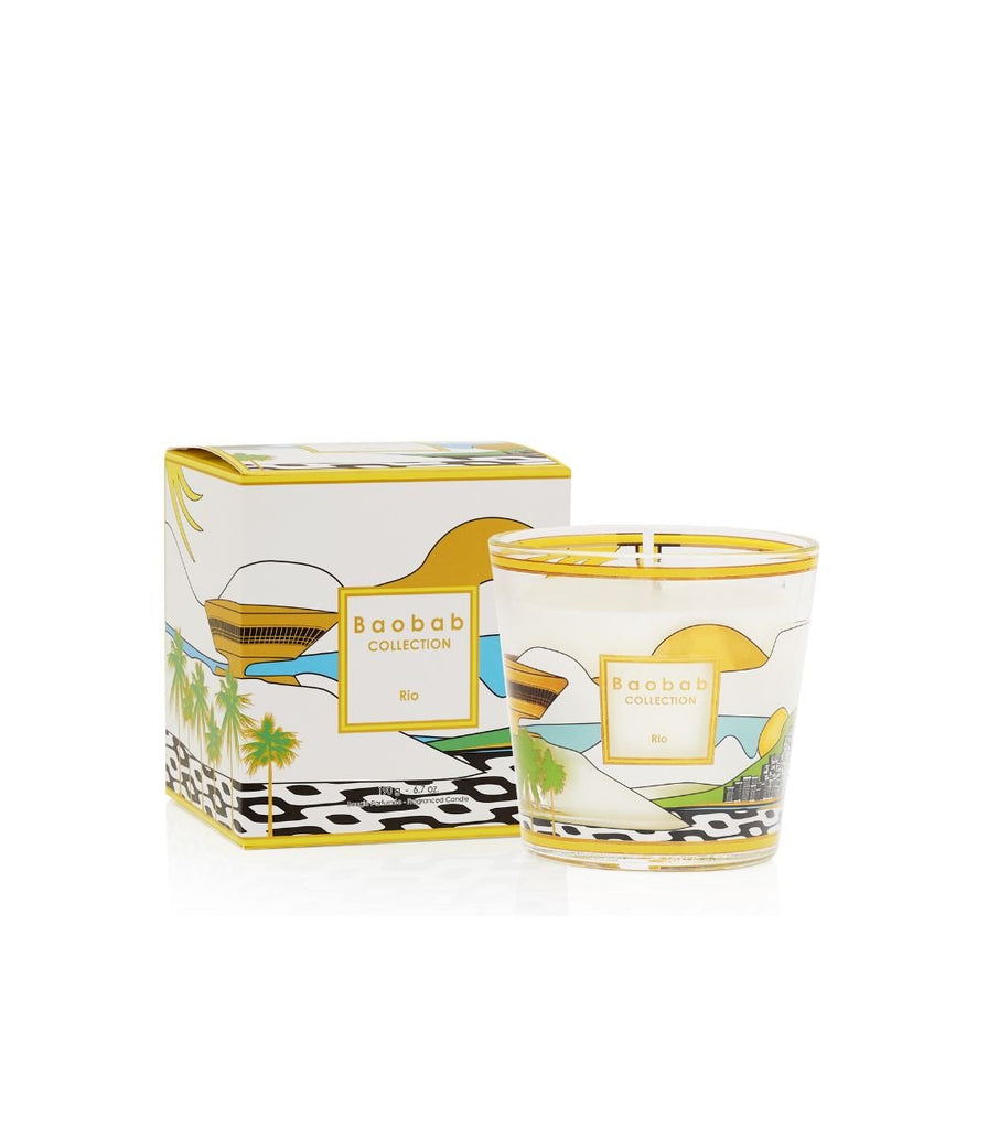 Experience the Baobab My First Baobab Rio candle (6.7oz), featuring vibrant illustrations of Rio landmarks, including Christ the Redeemer and palm trees. The glass is adorned with yellow and white accents that highlight its bergamot, green tea, and musk notes.