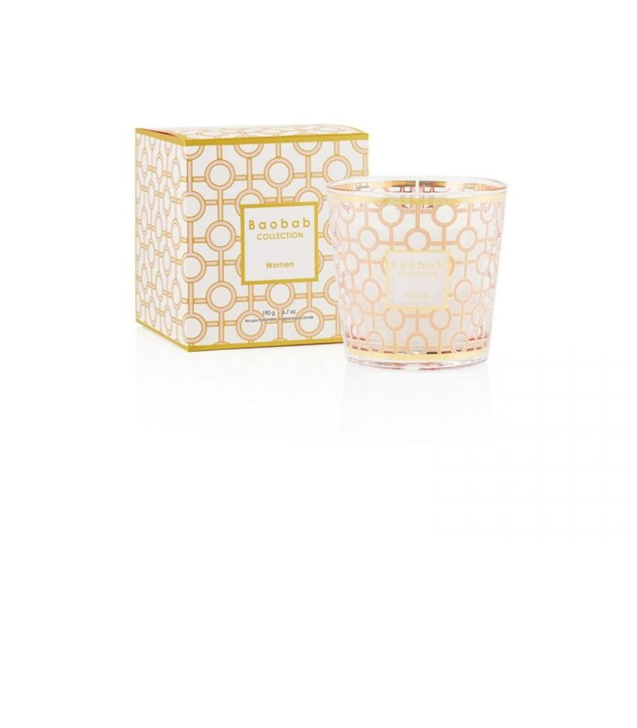 The Baobab - My First Baobab Womens 6.7oz Candle features a geometric pattern in a glass holder with gold accents and comes with a matching box. The design includes circular elements and the text Baobab Collection Women, making it an elegant, aromatic gift for any decor enthusiast.