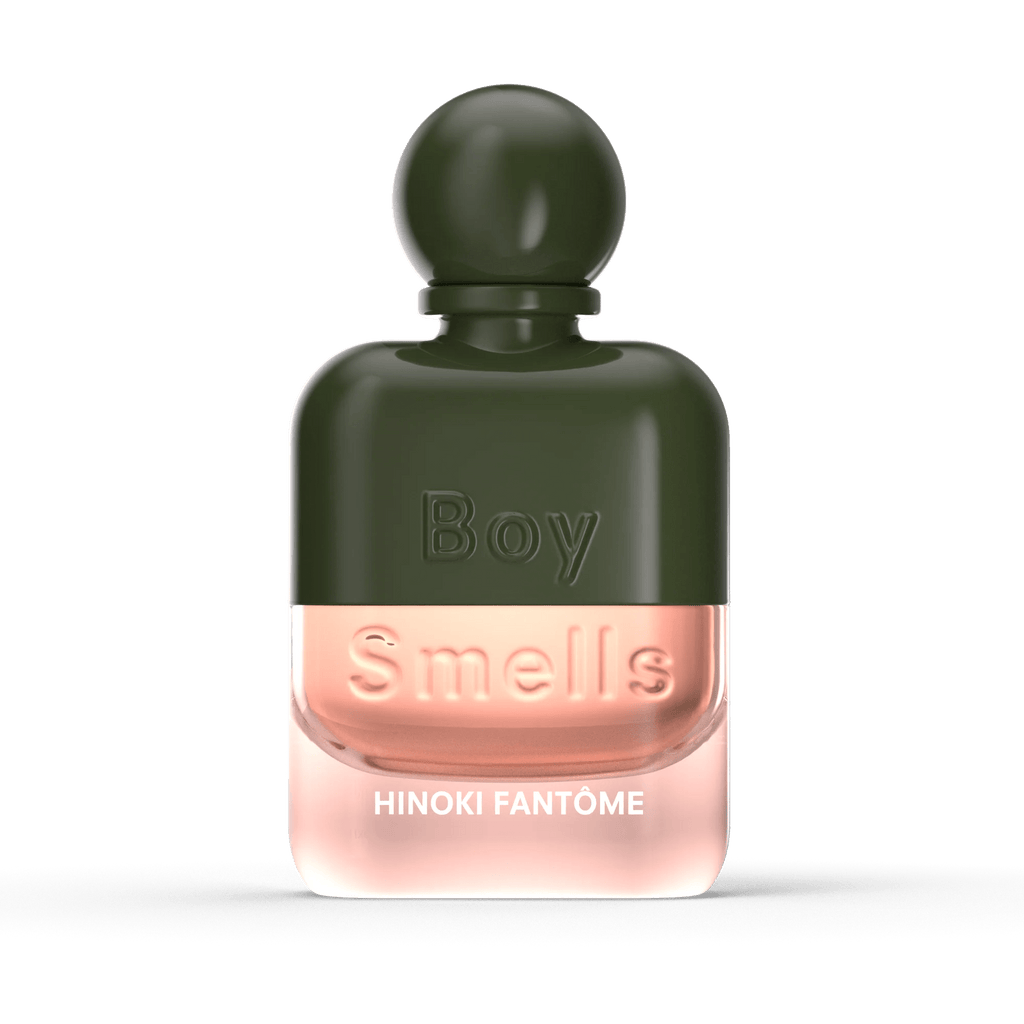 Boy Smells - Hinoki Fantome Eau de Parfum 50ml features a dark green cap and upper half, with a transparent lower half revealing light pink liquid—offering an elegant blend of cedarwood and cardamom notes.