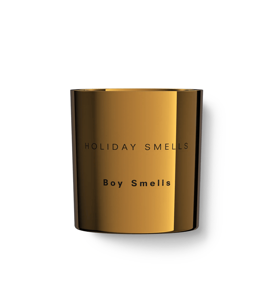 The Boy Smells Holiday Smells 8.5oz candle comes in a metallic gold container boasting the warmth of chai tea and cardamom. Its sleek, modern design reflects light beautifully, perfect for creating a cozy ambiance.