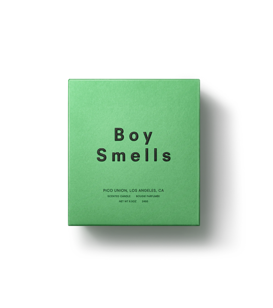 A sleek black background showcases a green box with Boy Smells in bold, featuring Pico Union, Los Angeles, CA and Scented Candle. This elegant packaging hints at herbal opulence akin to Italian Kush.