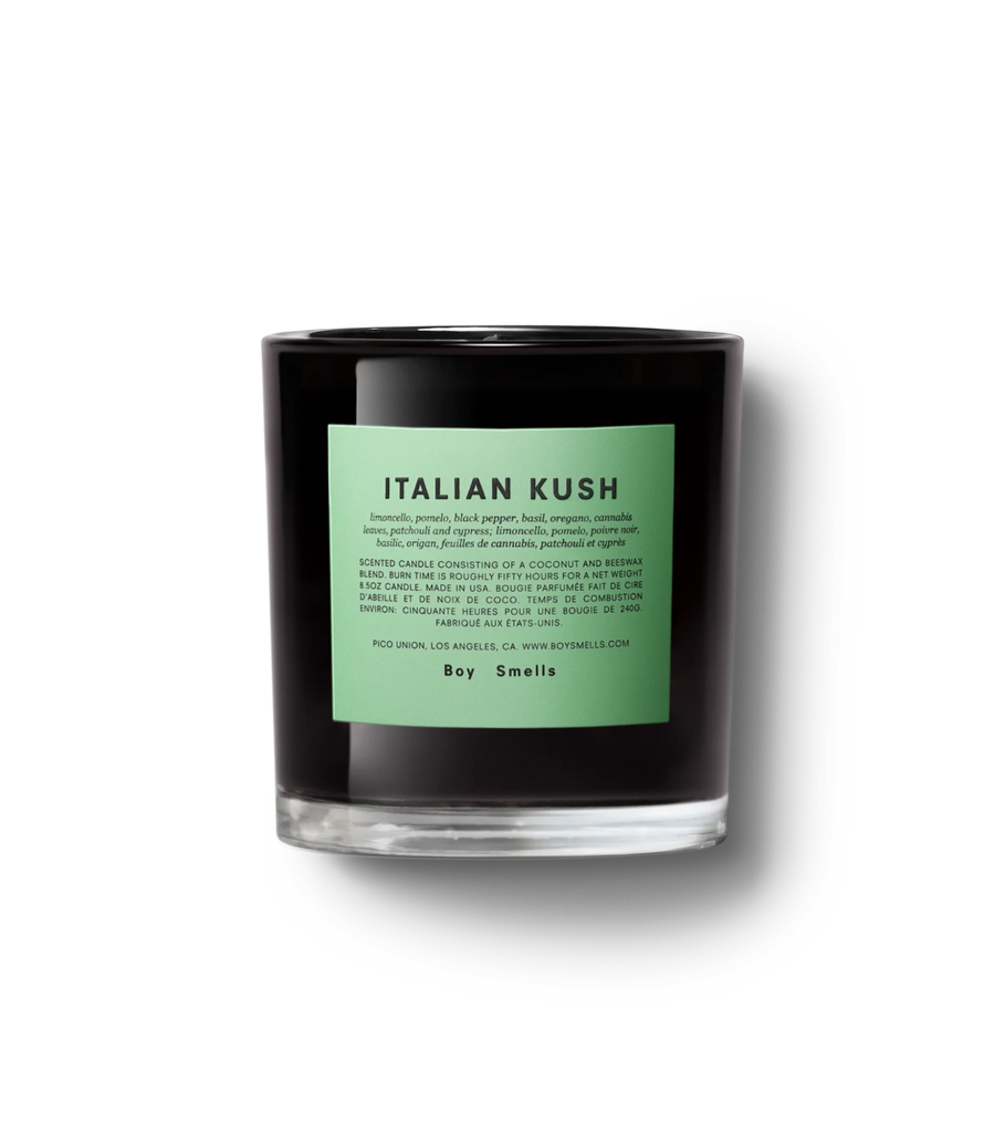 The Boy Smells - Italian Kush 8.5oz Candle features a black jar with a green label, emitting herbal opulence through limoncello, pomelo, black pepper, basil, oregano, and cannabis scents. Its citrus pepper fragrance contrasts elegantly with its plain black design.