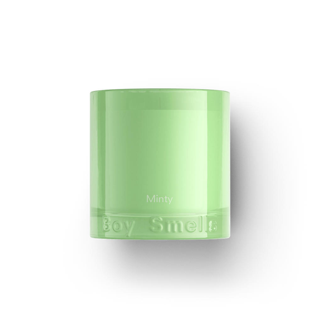 The Boy Smells - Minty 8.5oz Candle is a mint-green candle in a glass container with fresh green notes and hints of ginger, embossed with Boy Smells branding and set against a white background.