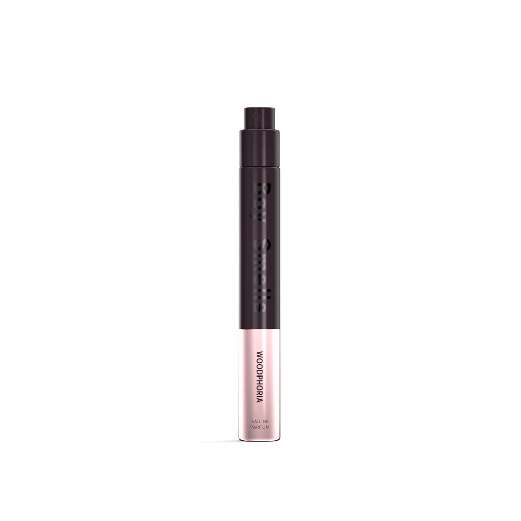 A sleek black and rose gold cylindrical tube labeled Boy Smells - Woodphoria Eau de Parfum 10ml stands vertically against a white background, evoking woody, sandalwood-inspired notes.