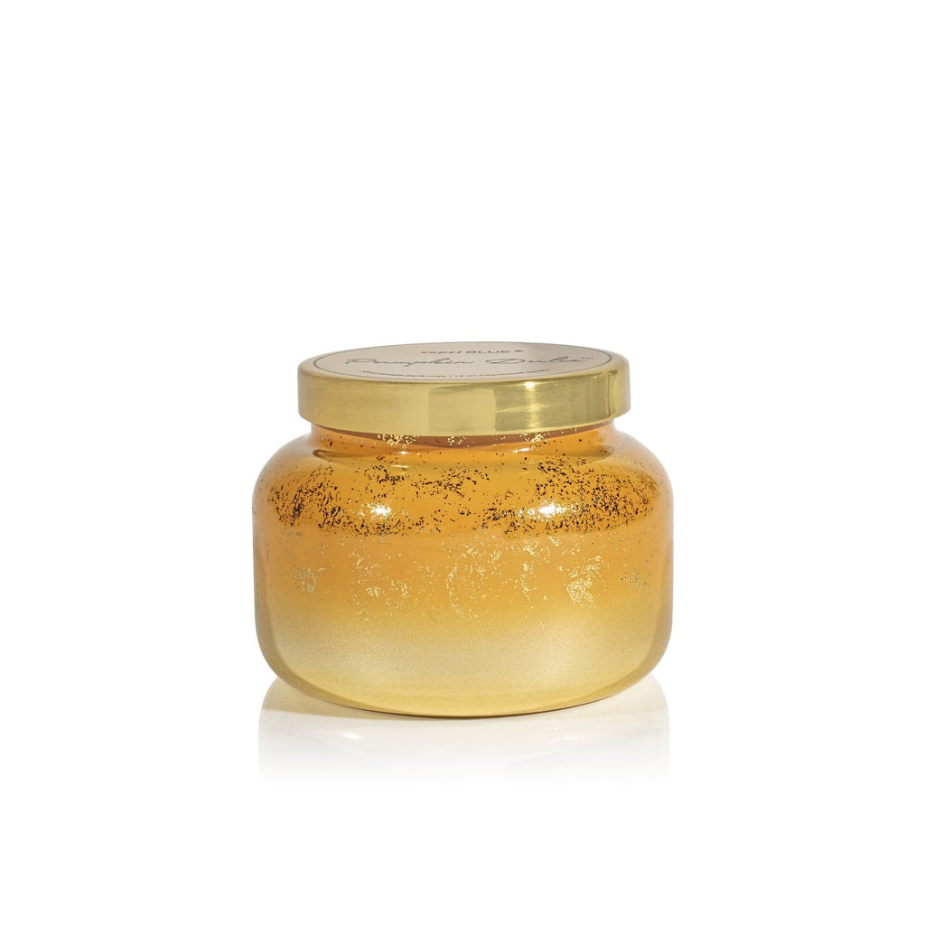 The Capri BLUE Pumpkin Dulce Glimmer Signature Candle, 19oz, features a gold ombre glass jar with a matching gold metal lid, rounded shape, and sparkly reflective finish, shown on a white background.