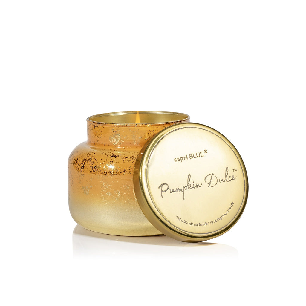 This unused Capri BLUE Pumpkin Dulce Glimmer Signature Candle (19oz) features a gold, speckled ombre glass jar with a metallic finish and capri BLUE lid—perfect for adding cozy fall fragrance to your space.