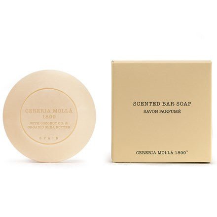 A round bar of Cereria Molla - Verbena Di Sicilia Scented Soap with Organic Shea Butter sits beside its beige square packaging, both inscribed with Cereria Mollá 1899, Spain. The box reads Scented Bar Soap, Savon Parfumé.