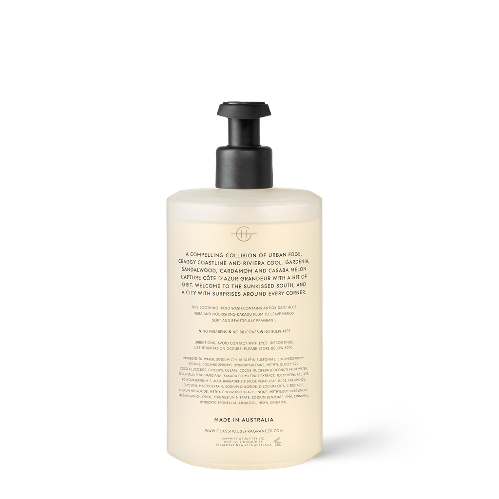 A bottle of Glasshouse Fragrances - Liquid Hand Wash - Marseille Memoir with pump dispenser, minimalist label featuring Cote d’Azur fragrance notes of cedarwood, cardamom, and gardenia. Infused with shea and aloe. Made in Australia.