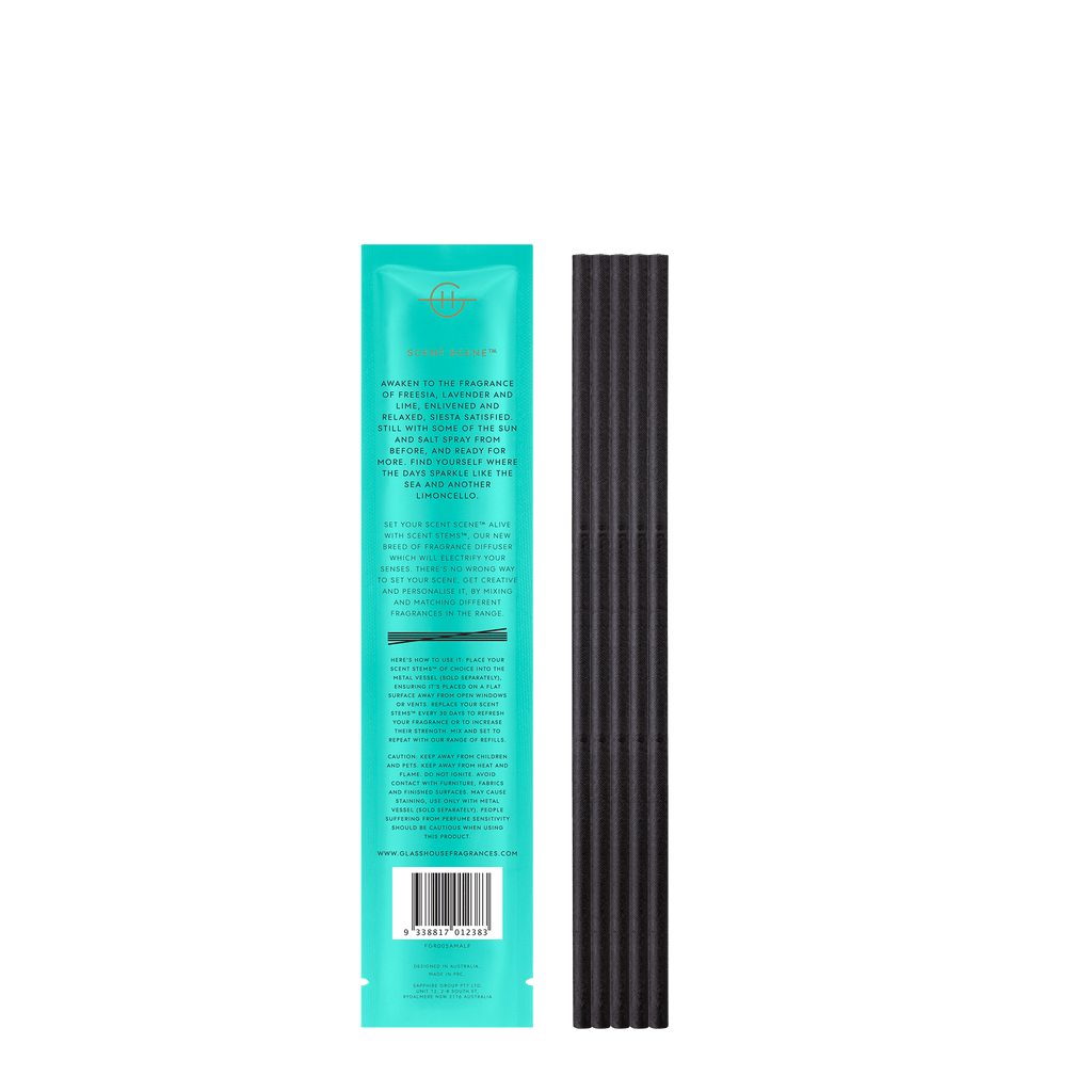 A turquoise package with gold text, labeled Lost In Amalfi Replacement Scent Stems by Glasshouse Fragrances, sits beside black ribbed incense sticks. It features text and a chic logo, ideal for fragrance refills.