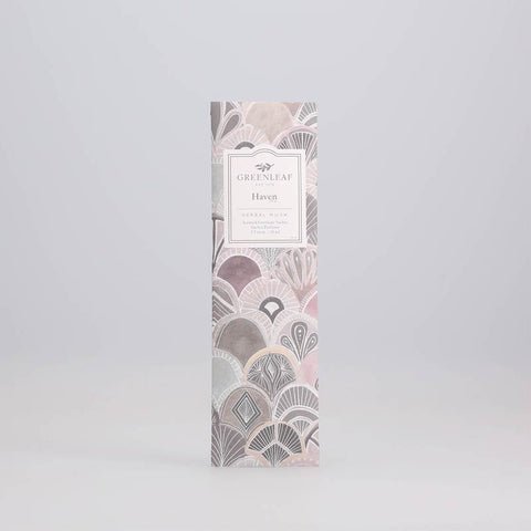 The Greenleaf - Haven Sachet is a slim, rectangular packet with a pastel art deco design in soft pinks, grays, and creams on a light gray background, offering the serene fragrance you desire.