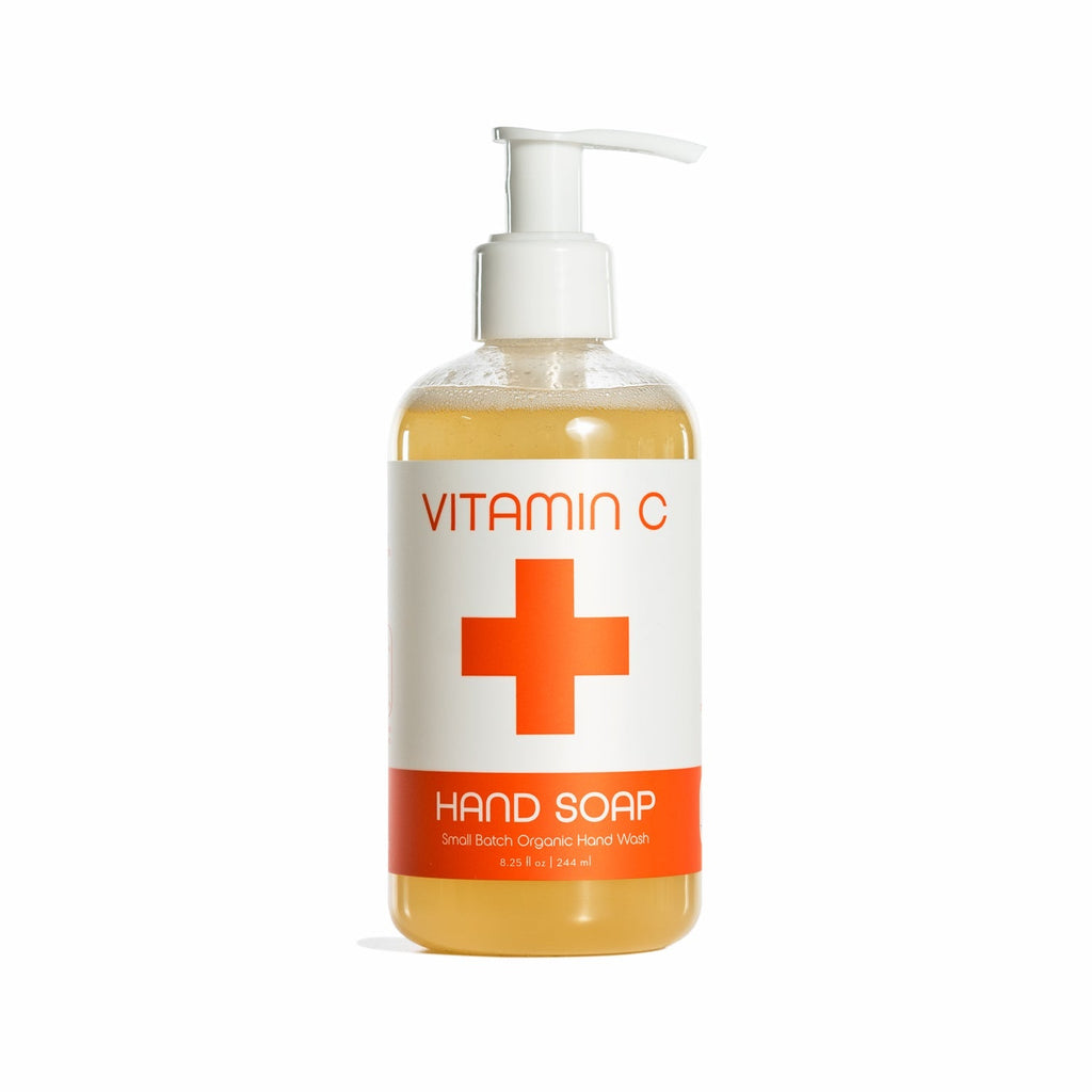 A pump bottle labeled Kalastyle Nordic+Wellness Vitamin C Organic Liquid Hand Soap features an orange cross, amber liquid, and invigorating citrus suds. The label highlights Small Batch Organic Hand Wash, infused with Organic Aloe Vera Juice for soothing care.