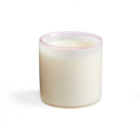 The unlit Lafco - Blush Rose Classic 6.5 Candle sits in a hand-blown glass holder with a blush rose tint on the top edge against a white background, adding elegance.