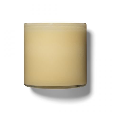 The Lafco - Chamomile Lavender Signature 15.5oz Candle features a creamy beige wax in a clear glass container, casting a shadow to the right on a white background.