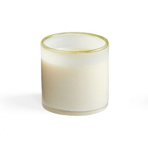 The Lafco - Feu De Bois Classic 6.5 Candle by Lafco, a white candle in a clear glass container, remains unlit on a white background. Its smooth surface releases subtle sandalwood hints for an elegant ambiance.