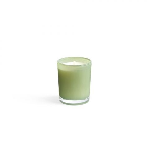 The Lafco - Fresh Cut Gardenia 1.9oz Votive Candle, nestled in a clear glass holder, is unlit against a white background, ready to release its calming Fresh Cut Gardenia scent throughout any space.