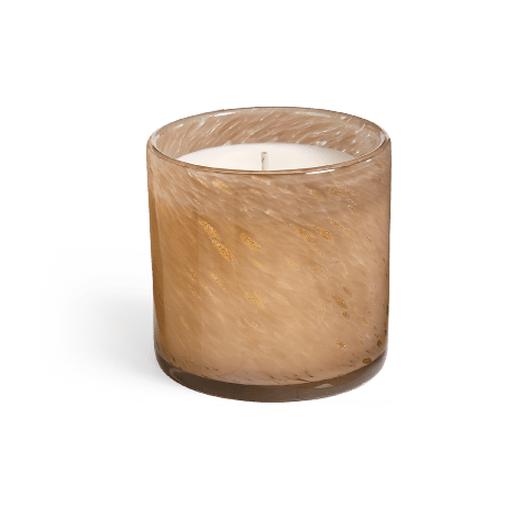 The Lafco Pumpkin Seed & Sandalwood Signature 6.5oz Candle features a brown marbled glass vessel with white wax and is infused with warm, earthy sandalwood notes, shown against a plain white background.