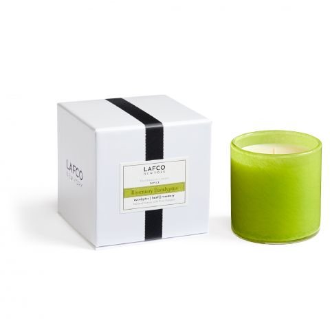 The Lafco - Rosemary Eucalyptus Classic 6.5 Candle, in a hand-blown green glass vessel, comes with a sleek white box and features essential oil-based fragrances for a fresh, invigorating scent.