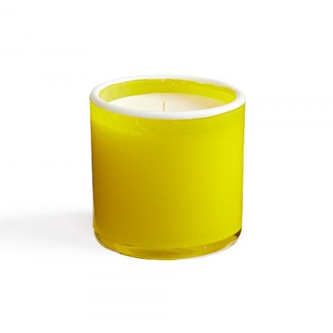 The unlit Lafco - White Grapefruit Classic 6.5 Candle, made of soy wax with hints of refreshing citrus, sits in a clear glass holder against a white background. It is nestled in a cylindrical glass with a wide opening.