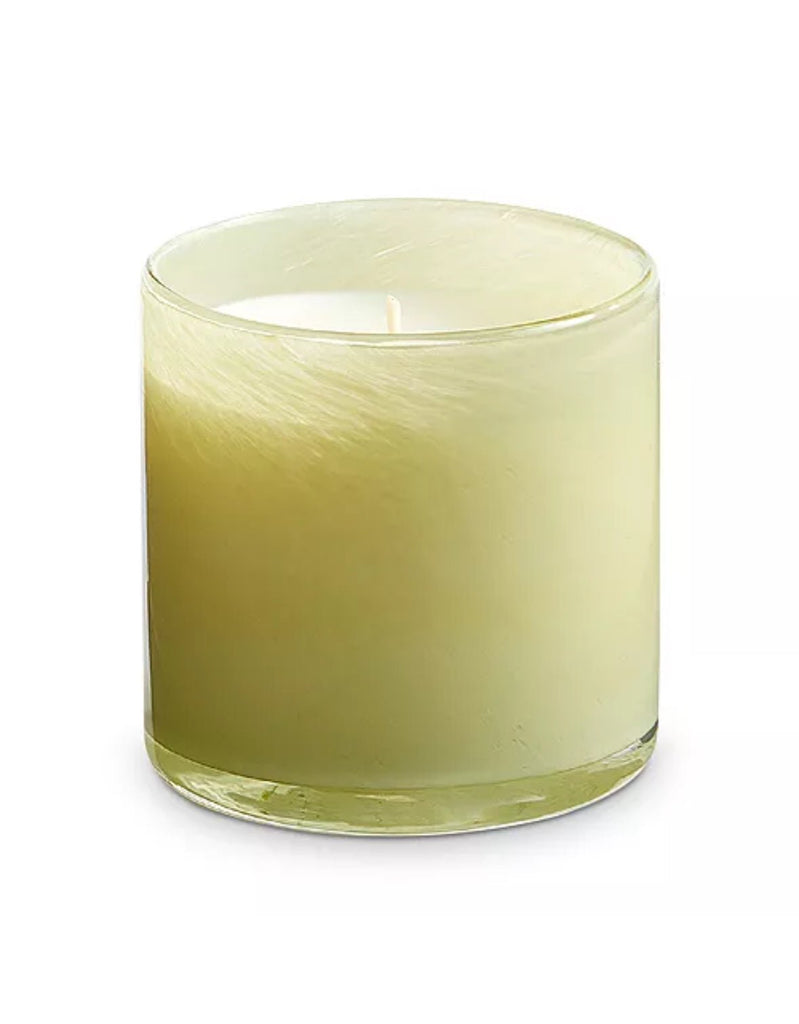 The Lafco - Wild Honeysuckle Classic 6.5 Candle features a light green wax nearly filling its clear glass jar. Its centered wick lends simplicity, and it releases the refreshing fragrance of wild honeysuckle.