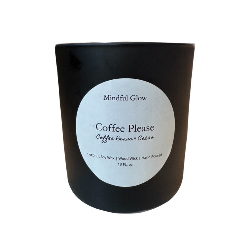 The Mindful Glow - Coffee Please Candle 13oz by Mindful Glow is a black jar with a white circle label listing its coffee beans + cacao scent, ingredients (Coconut Soy Wax, Wood Wick, hand poured), and size (13 fl oz).