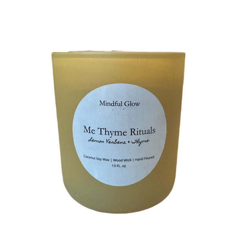 The Mindful Glow - Me Thyme Rituals Candle 13oz features lemon verbena scent, hand-poured coconut soy wax, a woodwick for soothing ambiance, and comes in a glass jar by Mindful Glow.