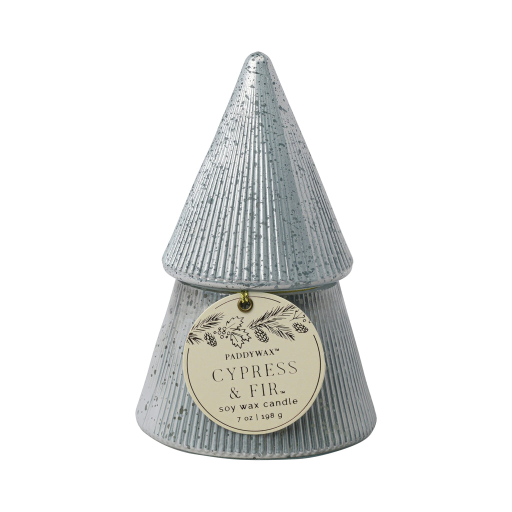 A silver cone-shaped candle with a ribbed texture, resembling a stylized Christmas tree, features the Cypress & Fir scent. The circular label reads: Paddywax, soy wax candle, 7 oz.