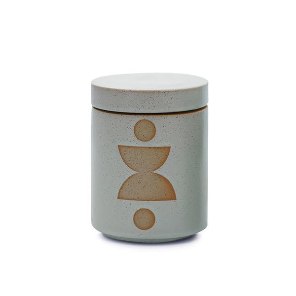 The Paddywax - Form Ocean Rose + Bay 12oz Candle is a sophisticated beige ceramic jar with lid, perfect as a planter or fragrance container. It features a minimalist brown geometric design with vertical circles and double curves by Paddywax.