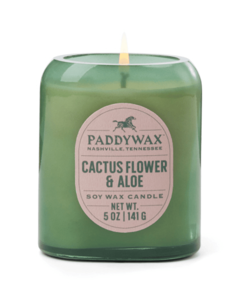 The Paddywax Vista Cactus Green Glass 5oz Candle from Nashville exudes vintage charm with its Cactus Flower & Aloe scent, embodying the essence of American West fragrances. Made of soy wax.