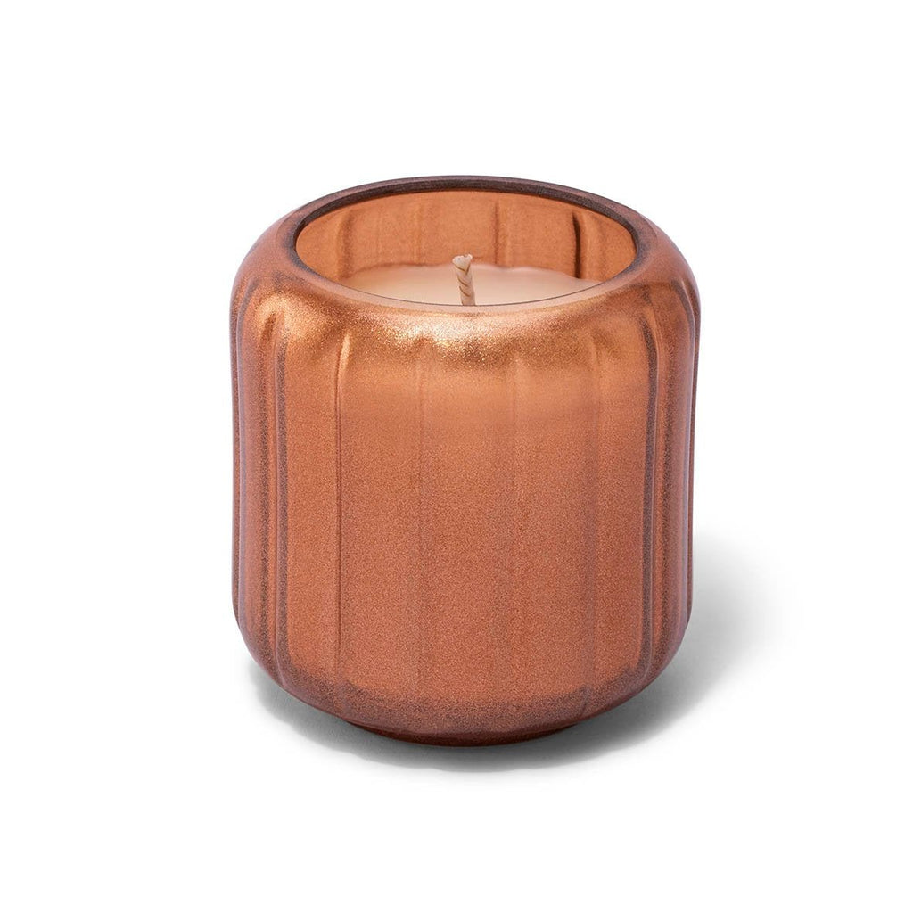 The Skeem Copper Candlescape 8 oz Candle in Spiced Citrus features a metallic copper ribbed glass holder and single wick, adding festive fragrance and style to any room.