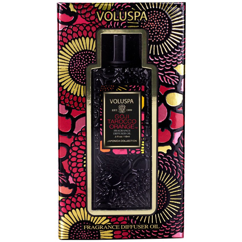 Close-up of Voluspa - Goji Torocco Orange Ultrasonic Diffuser Oil box features intricate floral designs in gold, black, and deep red with bold text showcasing the scent and brand, reminiscent of an ultrasonic diffuser experience.