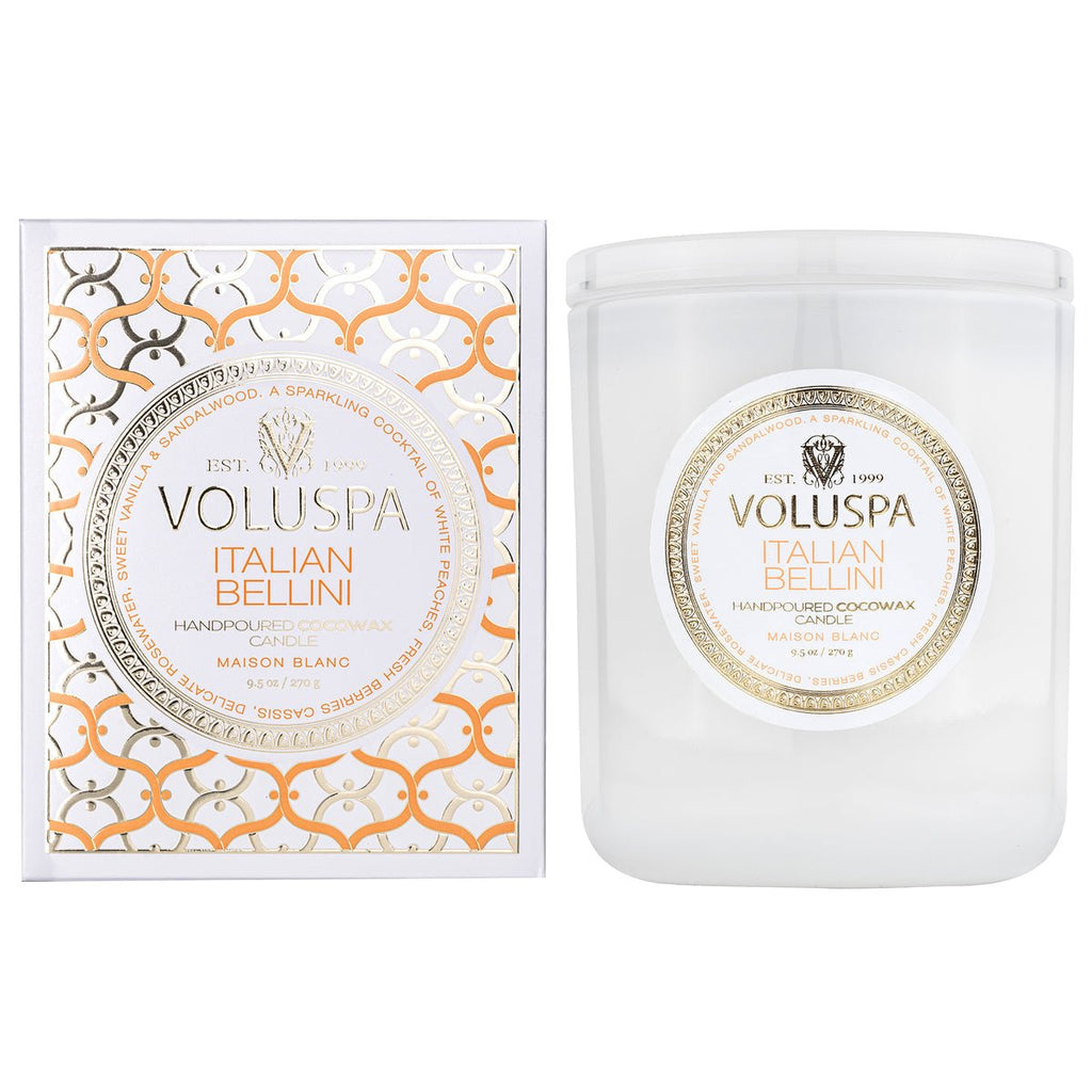 The Voluspa Italian Bellini Classic Candle 9.5oz, in a white jar and matching box with gold and silver design, exudes luxury. Hand-poured with coconut wax and natural wicks, it offers a serene burn that enhances its sparkling Champagne-inspired allure.