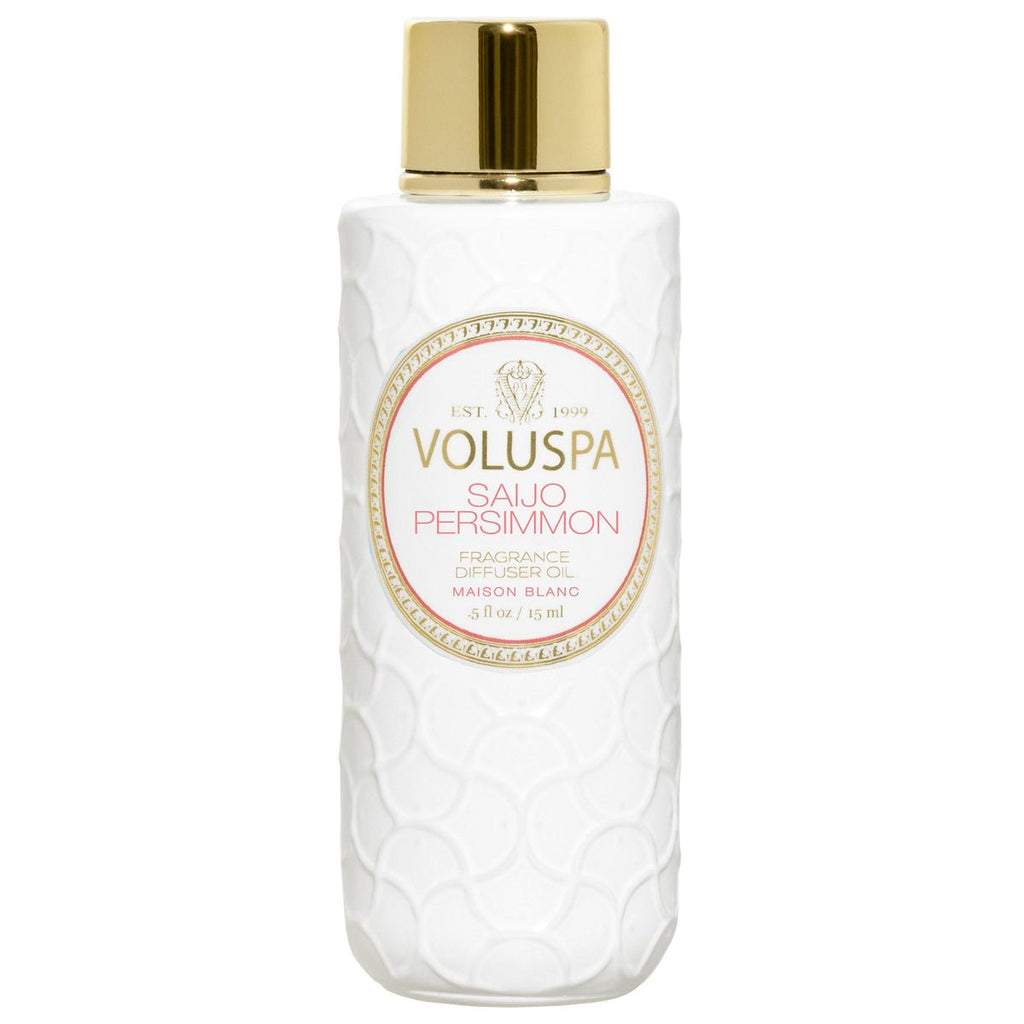 A white bottle of Voluspas Saijo Persimmon Fragrance Ultrasonic Diffuser Oil, featuring a gold cap and embossed pattern, exudes an enchanting jasmine aroma. A round label with gold and peach accents elegantly displays the Voluspa brand and product name at its center.