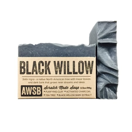 A Wild Soap Bar - Black Willow by A Wild Soap Bar is a handmade, purifying soap for acne with activated bamboo charcoal, tea tree, and black willow bark extract. Its dark gray color and textured top highlight its detoxifying blend.