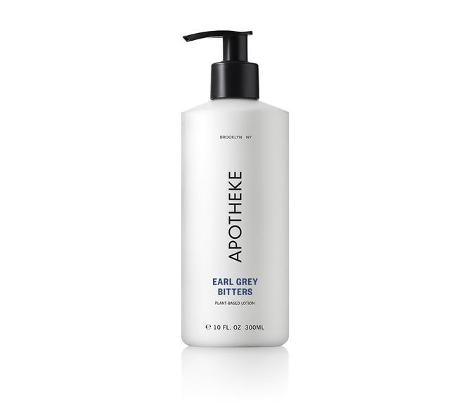 A 10 fl. oz. (300 ml) white pump bottle from Apotheke labeled APOTHEKE contains their Earl Grey Bitters Lotion, a plant-based moisturizer in a minimalist design with black text, offering style and hydration.