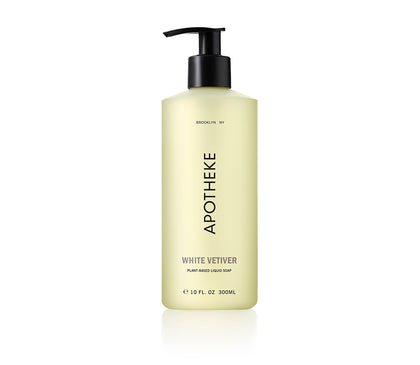 The Apotheke White Vetiver Liquid Soap features a sleek black pump top and a pale yellow label stating Brooklyn NY, Apotheke, White Vetiver, Plant Based Liquid Soap, 10 fl. oz. 300ml, infused with natural botanicals.