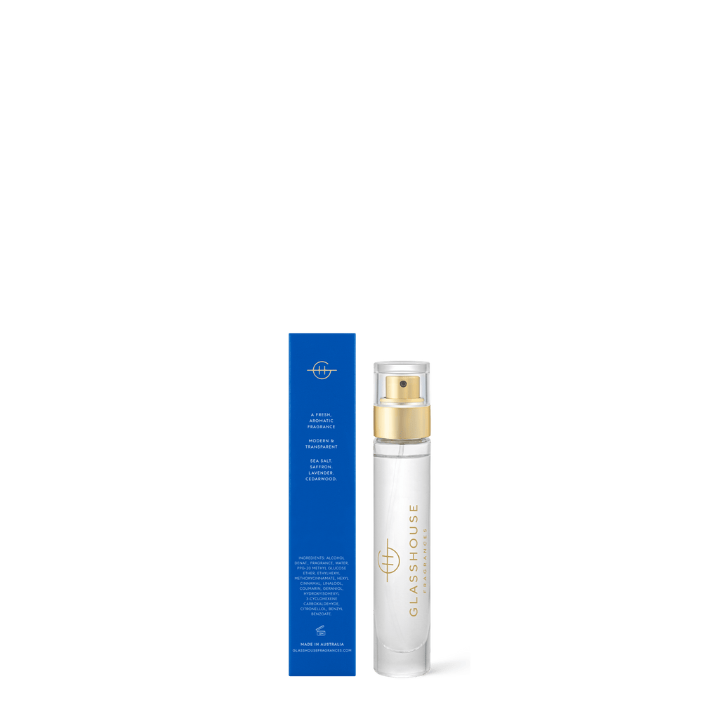 A Glasshouse Fragrances Eau de Parfum 14ml - Diving Into Cyprus bottle in white and gold stands beside its blue box, both set against a white background.