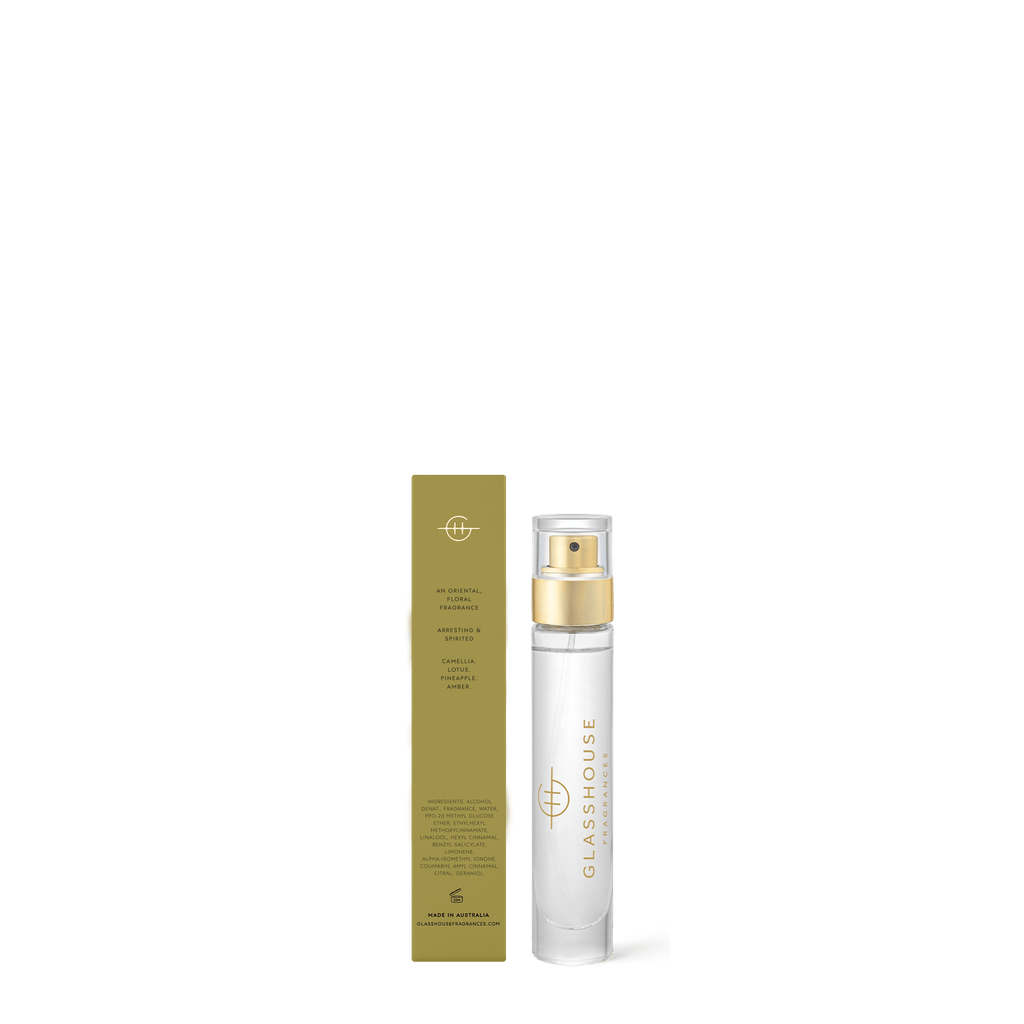 A clear 14ml Glasshouse Fragrances Kyoto In Bloom Eau de Parfum bottle with a gold cap stands beside its gold and white box, both featuring the Glasshouse logo and fragrance details.