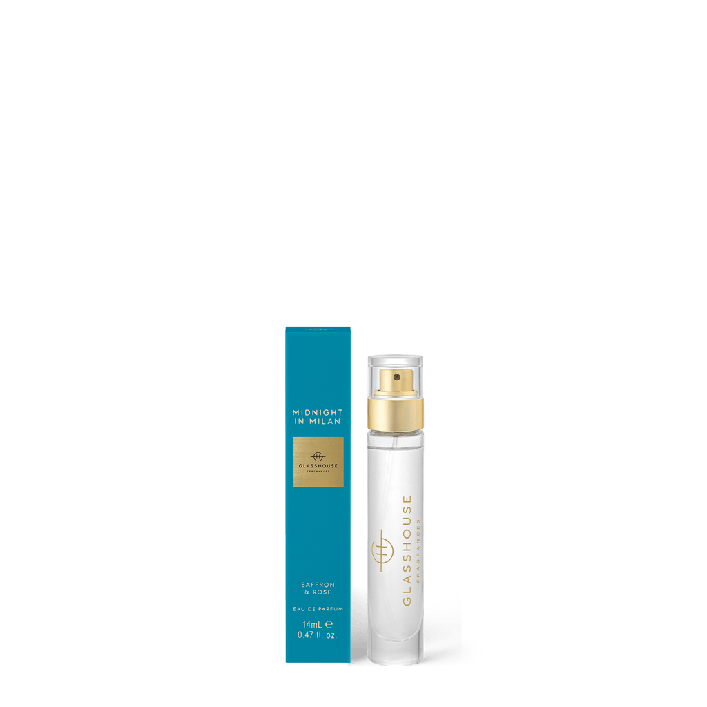 A clear Glasshouse Fragrances Eau de Parfum 14ml Midnight In Milan spray bottle is shown next to its blue and gold box labeled with Saffron & Rose notes.