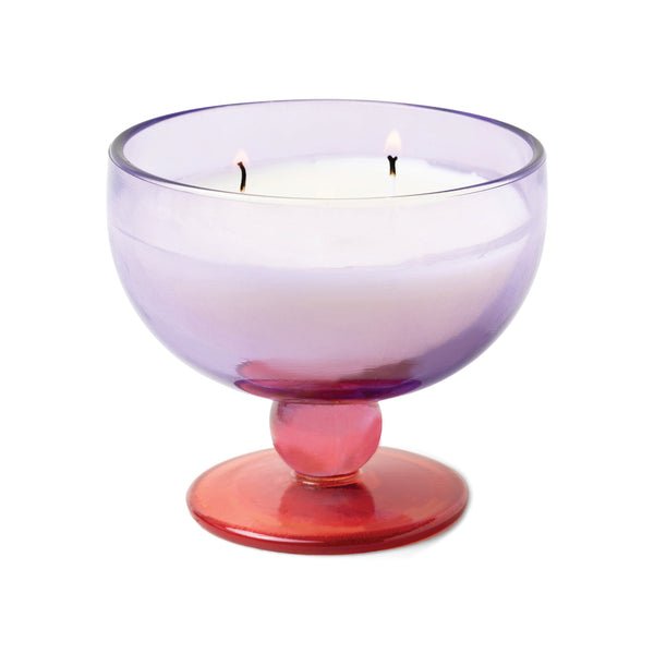 The Paddywax Aura Candle Pepper & Plum features a red base vintage glassware holder and releases the enticing aroma of pepper and plum from its three wicks.