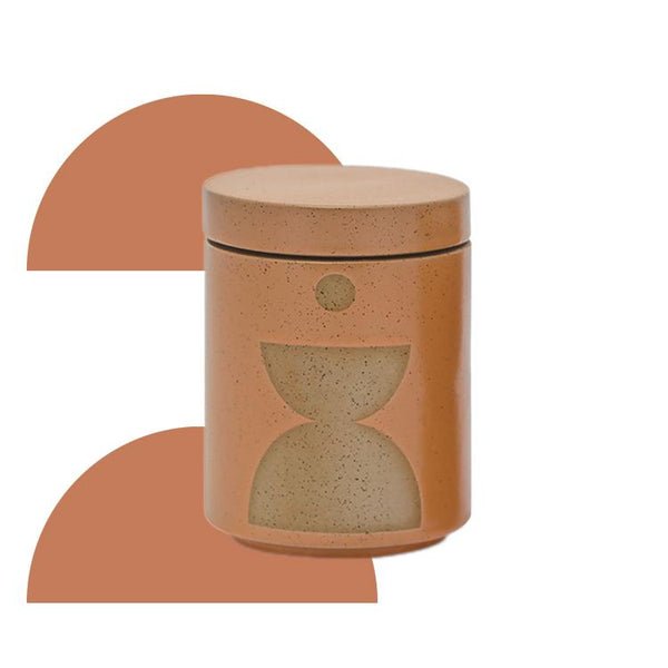 The Paddywax - Form - Wild Fig + Vetiver 12oz Candle features a cylindrical speckled terracotta ceramic jar with a fitted lid and minimalist geometric shapes, including two semi-circles and a circle, on the front.